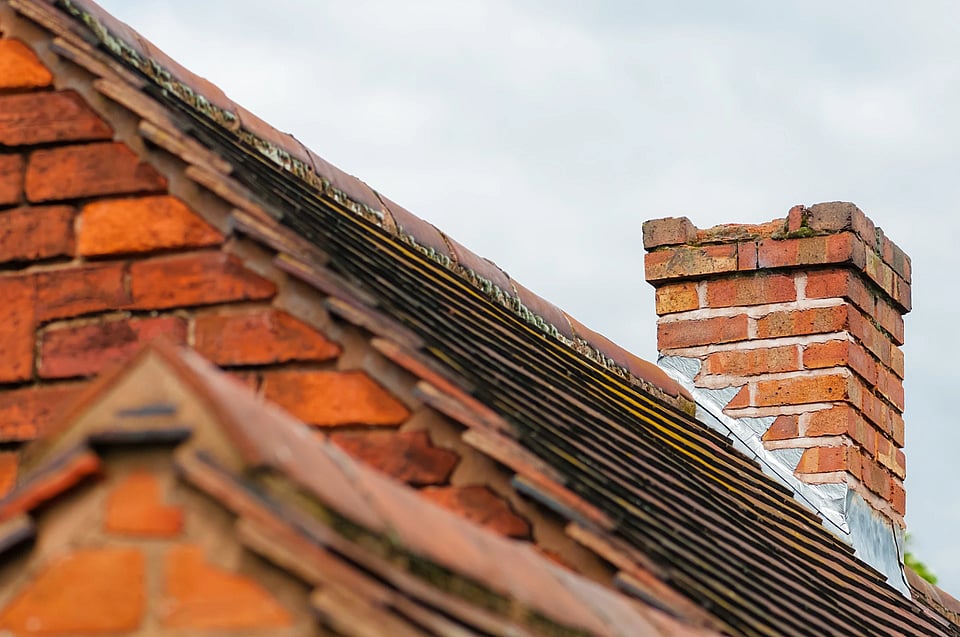 Adobe Stock image of a broken down masonry chimney.