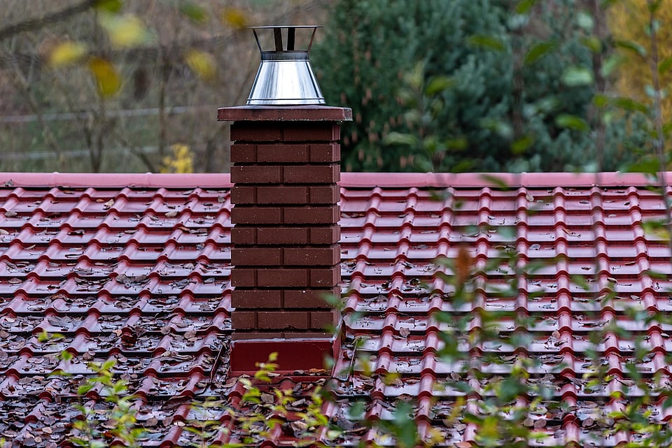 Adobe Stock image of a masonry chimney in the rain.