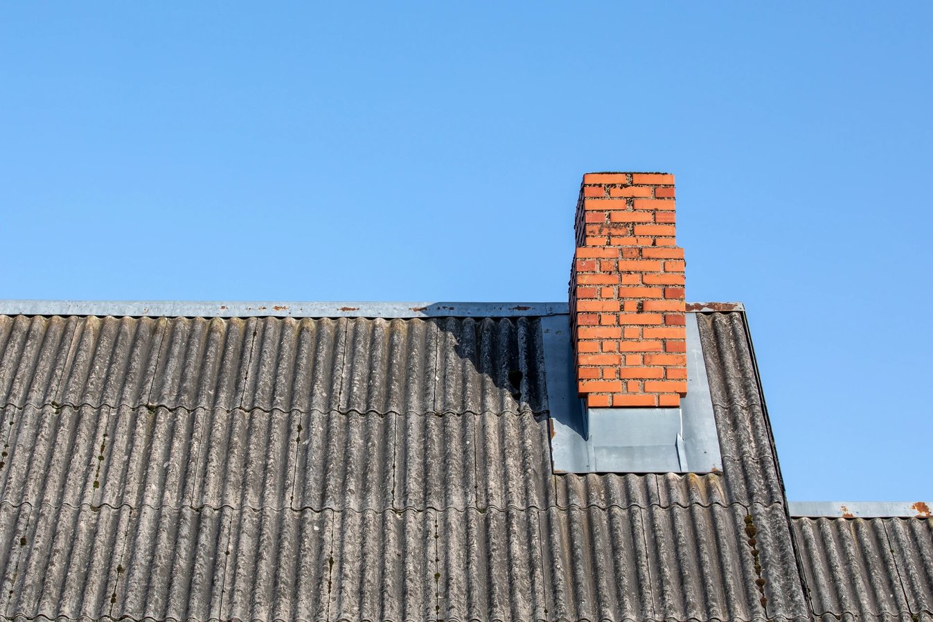 Adobe Stock image of a masonry chimney that's starting to break down.