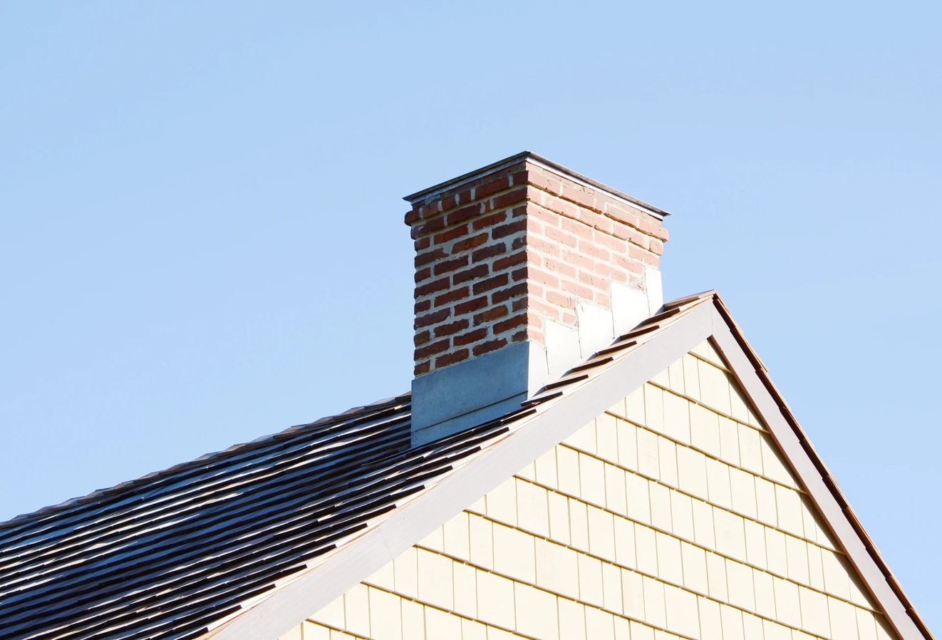 Adobe Stock image of a masonry chimney with flashing.