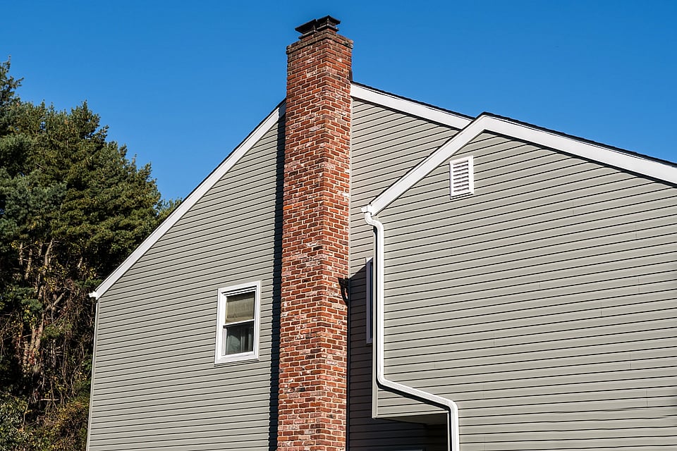 Adobe Stock image of a tall brick chimney.