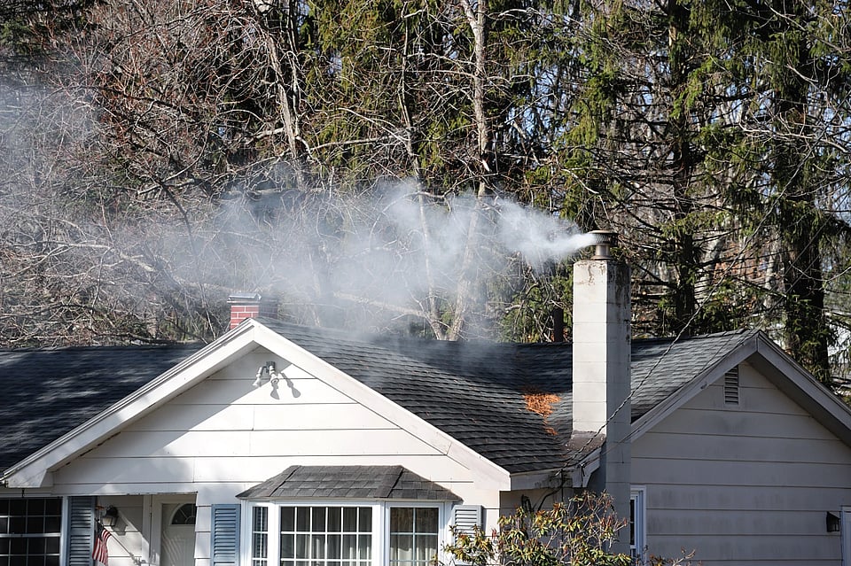 Adobe Stock image of smoke coming out of chimney chase.