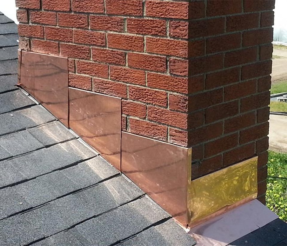 Original image of a chimney flashing repair completed by Alpine Chimney Sweeps.