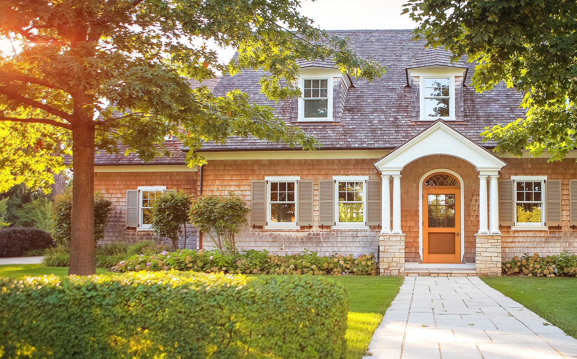 Adobe Stock image of a walkway up to a front door of a house.