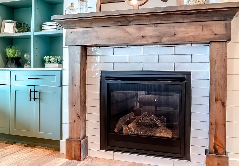 Fireplace with a white brick surround in a Pataskala Ohio home