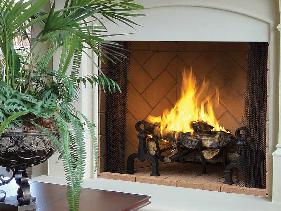 Superior wood fireplace in a living room.