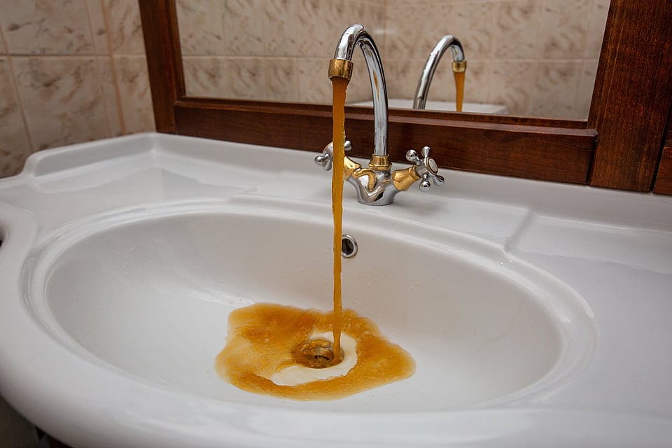 Brown water coming out of a faucet