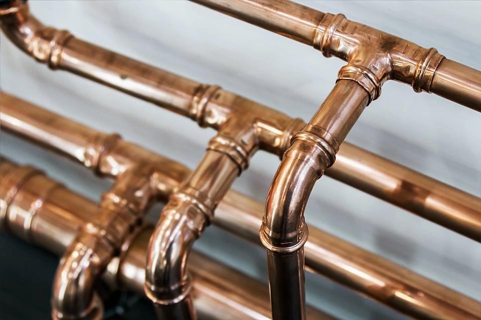 A series of copper pipes.