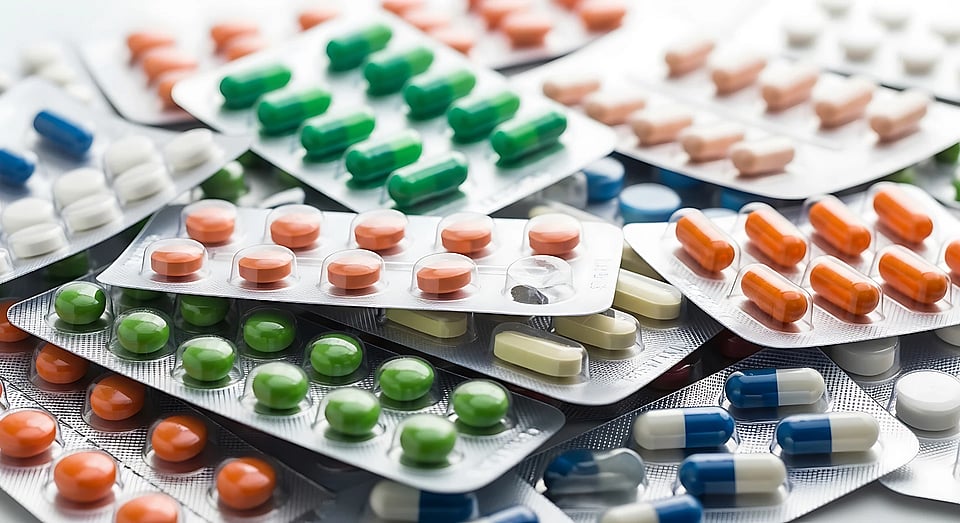 A pile of pharmaceuticals in pill packets.