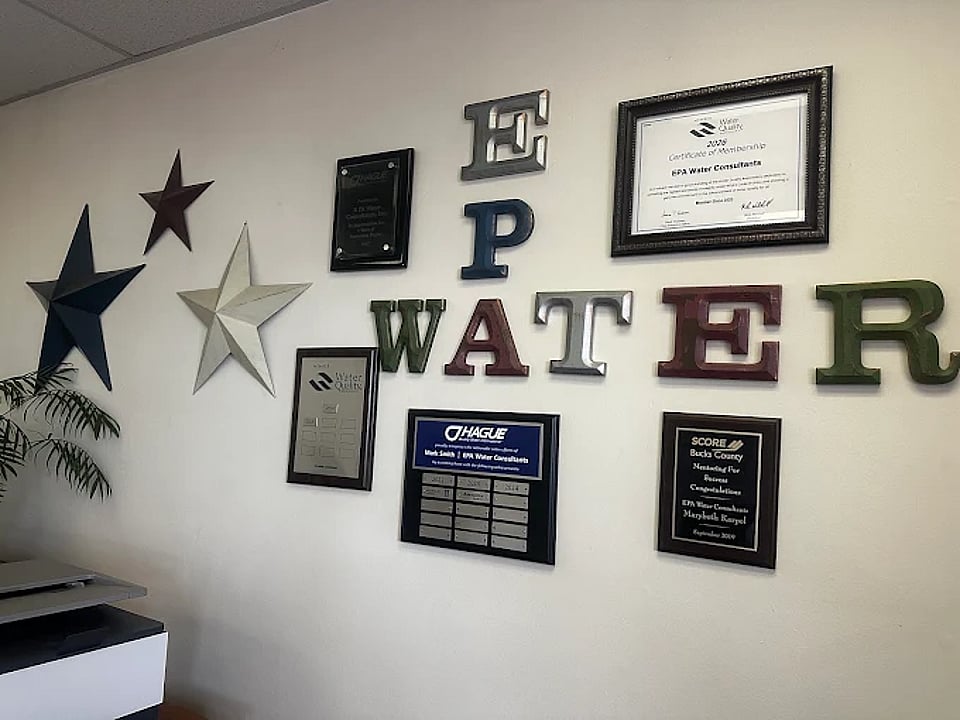 Signs and certificates on the wall of EPA Water's office.