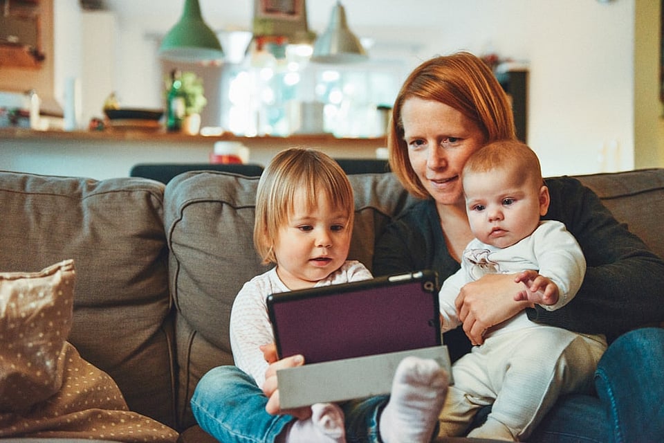 A happy family enjoying clean, pure water at home thanks to Moore Water treatment systems