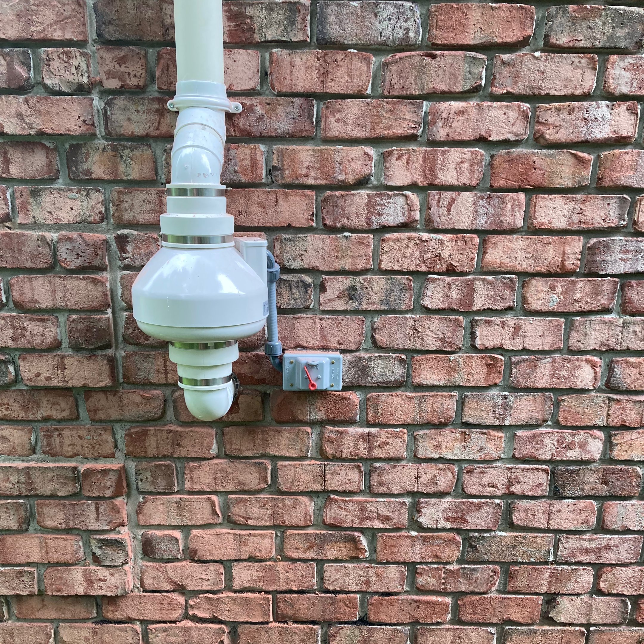 Radon mitigation fan system installed on a New Jersey home to reduce radon gas levels