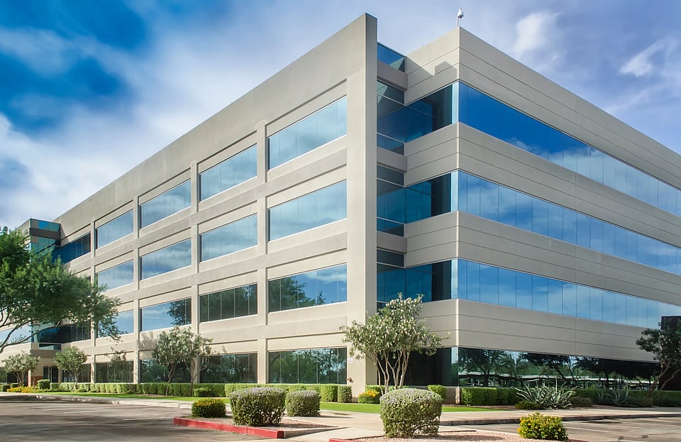 A large business building with long windows.