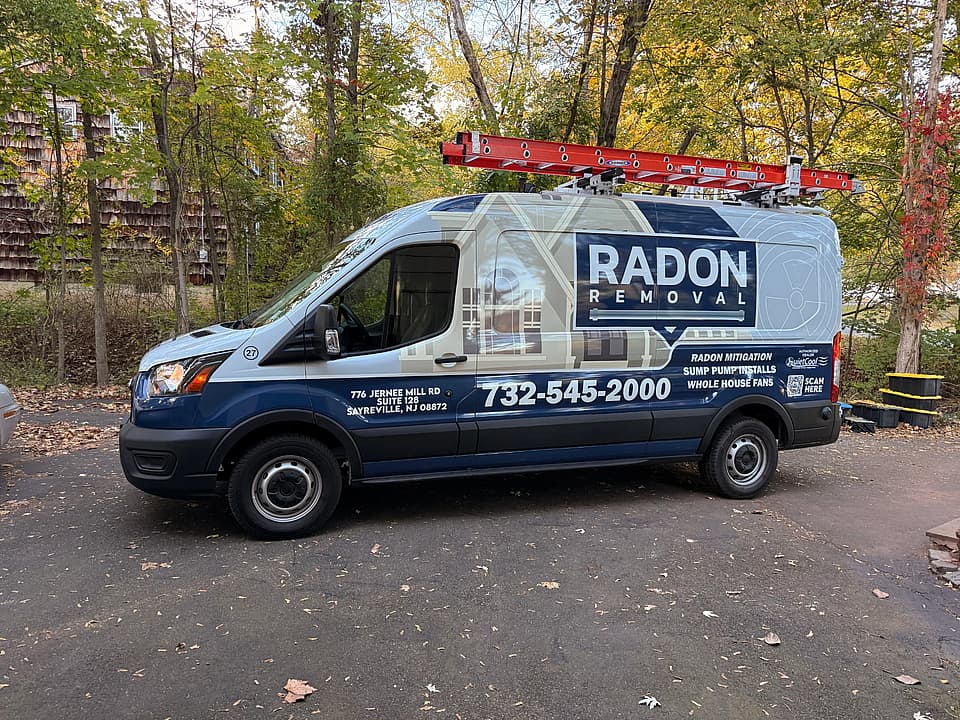 Radon Removal branded service van with company logo and contact information