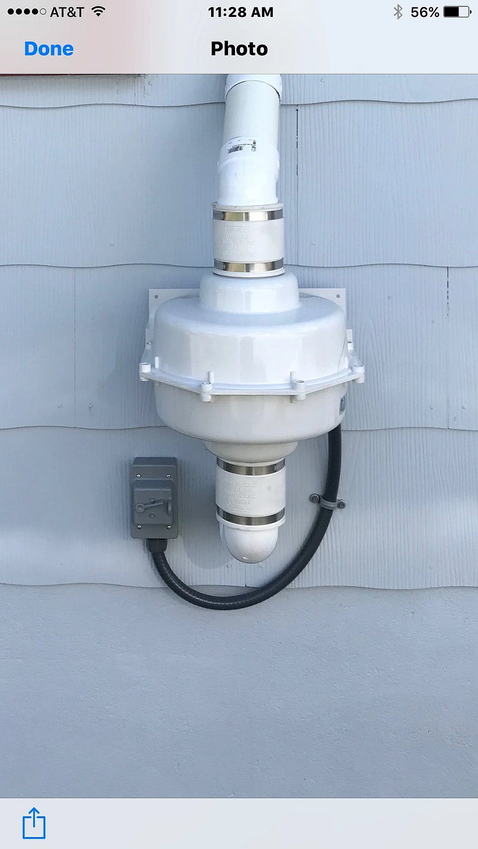 A straight-forward view of a radon mitigation fan.