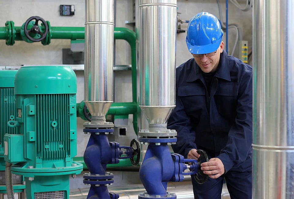 Technician working on water pipes