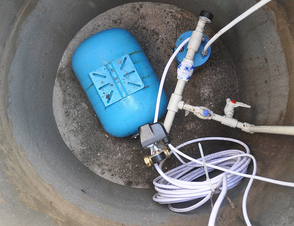 Adobe Stock image of a well pump in a well.