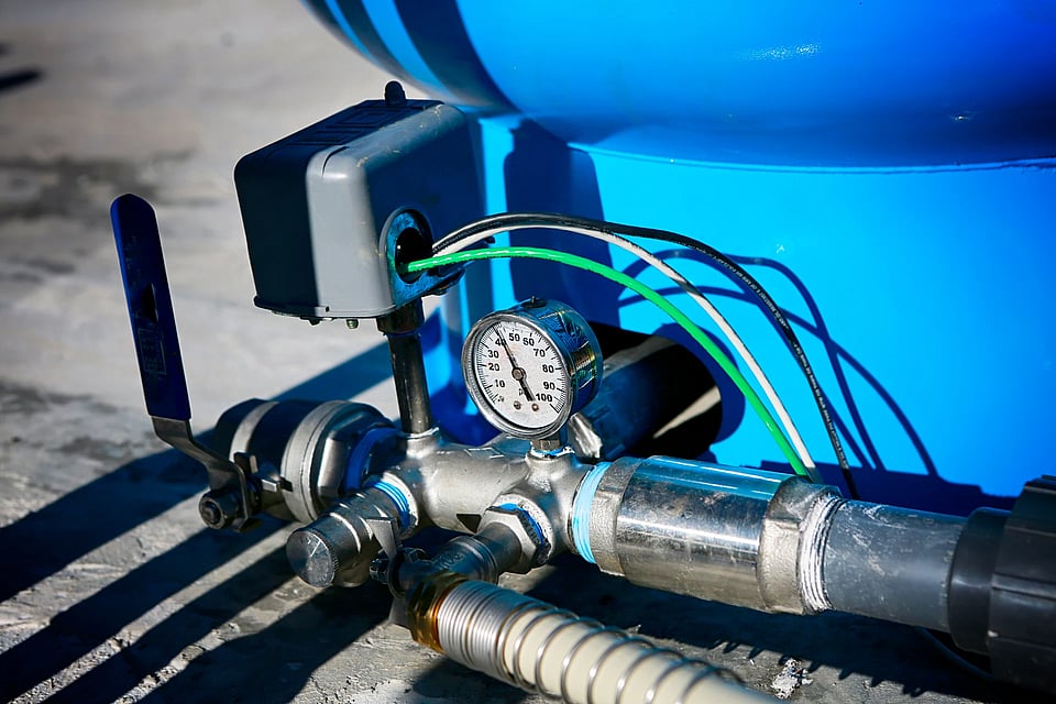 Adobe Stock image of the pressure gauge on a well tank.