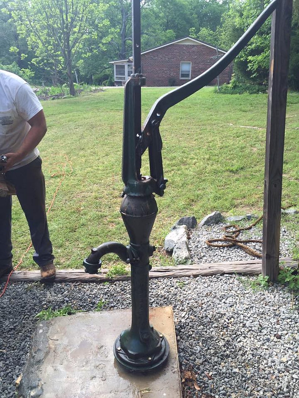 Original photo of a hand water pump installed by Rowan Well Drilling.