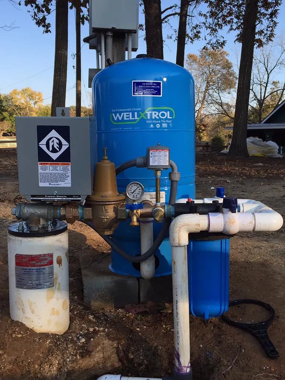 Original photo of a well water pump and irrigation system installed by Rowan Well Drilling.