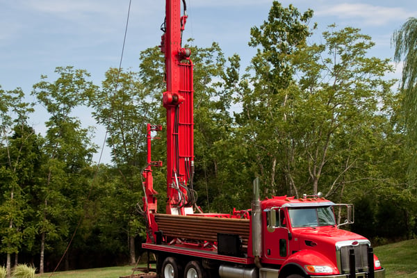 Rowan Well Drilling commercial drilling rig operating in mountainous terrain in North Carolina
