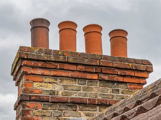 Chimney pots on a masonry chimney