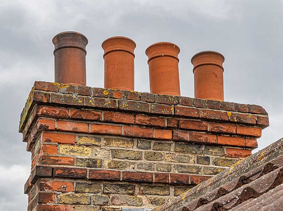 Chimney pots on a masonry chimney