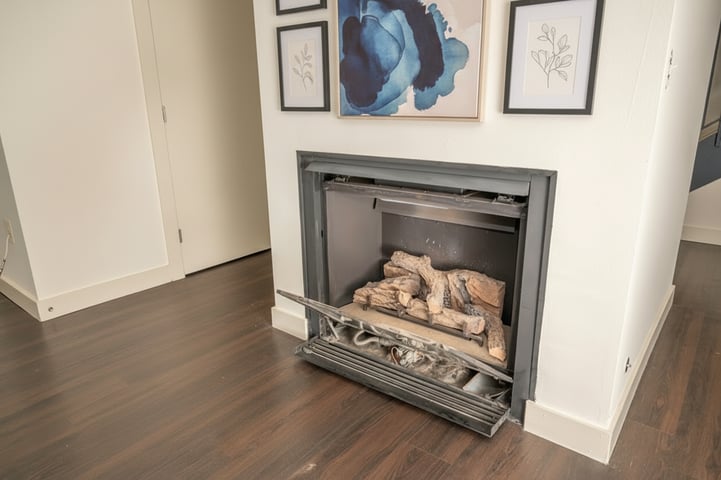 Adobe Stock image of a gas fireplace open for repairs.