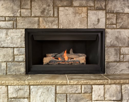 Gas fireplace with a brick surround
