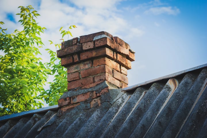 Masonry chimney experiencing decay and in need of repair work