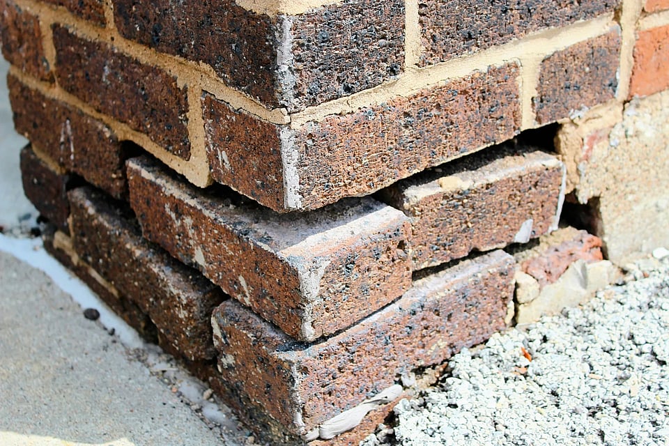 Adobe Stock image of broken down bricks that need tuckpointing work.