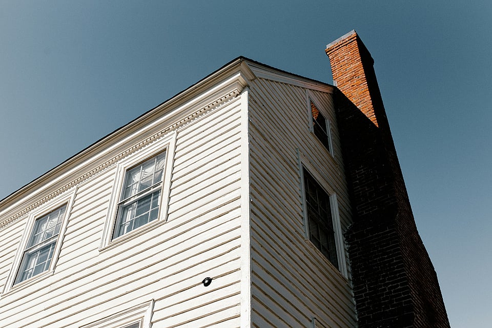 House exterior with masonry chimney